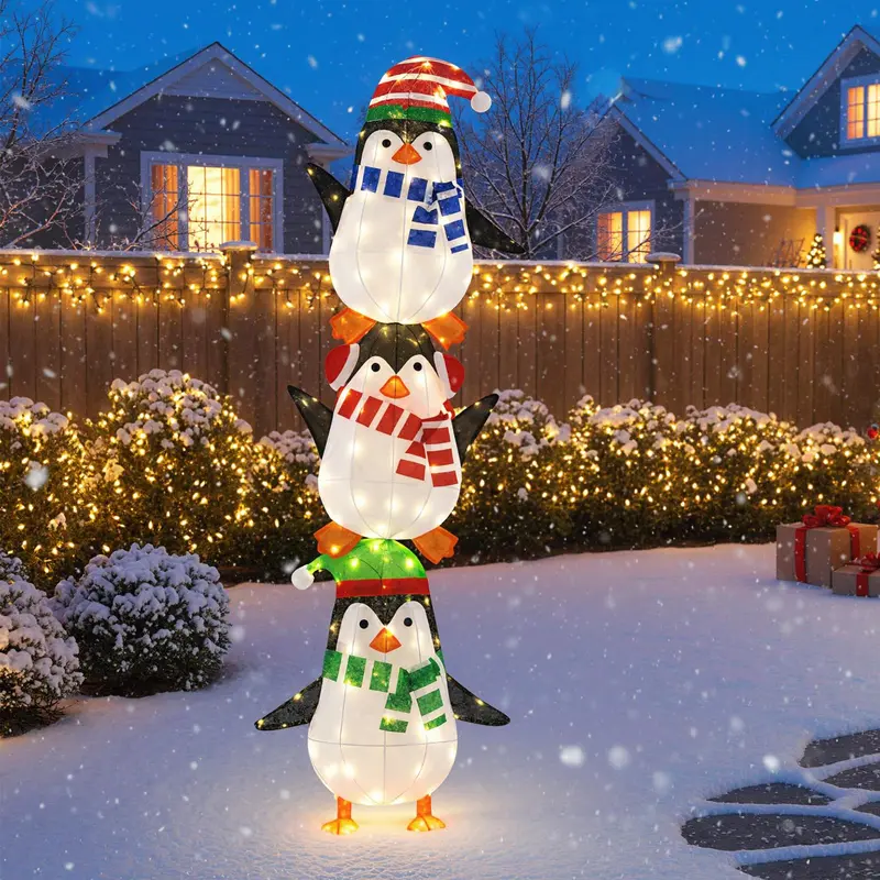 Beleuchtete Pinguin-Dekoration mit warmweißen Lichtern und niedlichen Hüten